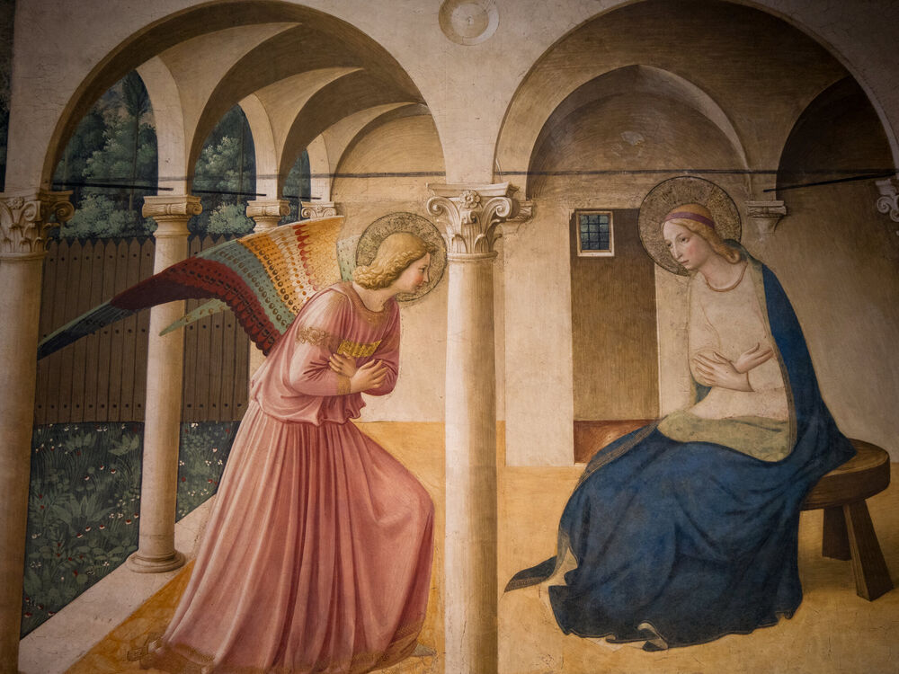 Fra Angelico's Annunciation fresco with the angel Gabriel and Mary under painted arches, San Marco, Florence