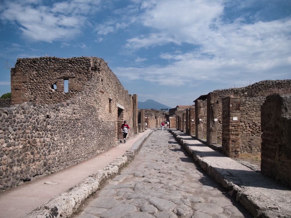 Stone street in Pompeii with Vesuvius in the background