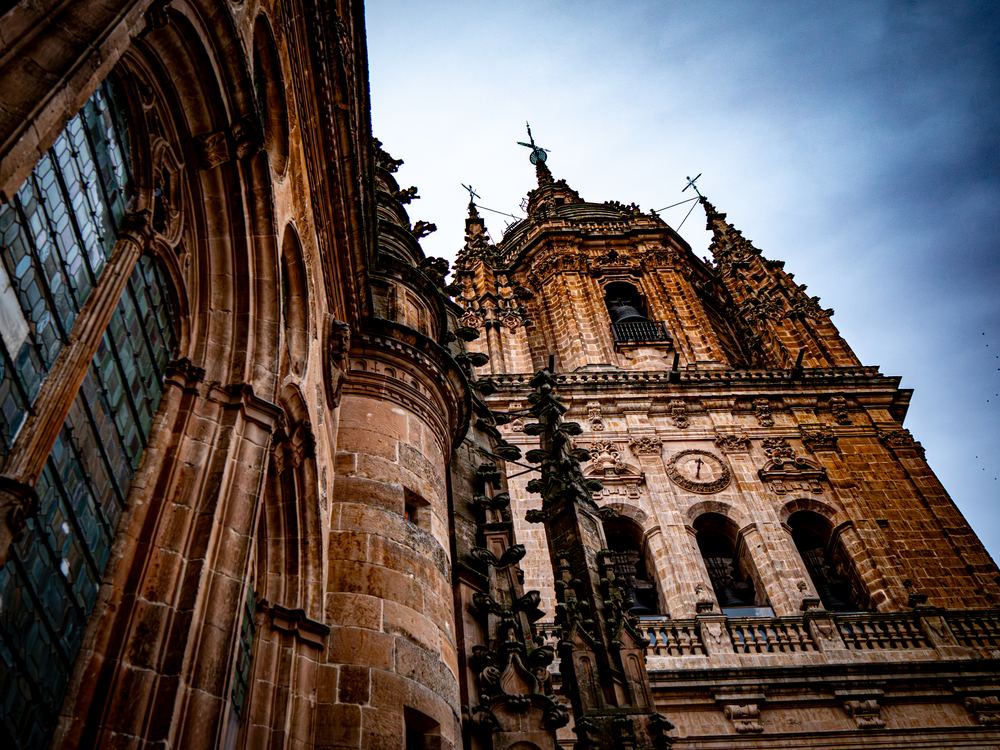 Baroque cathedral tower in Salamanca seen from below